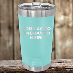 A Kodiak Coolers Custom Pint Glass 16 oz, laser-engraved with your logo or design, shown with a metal lid and silver accents. Take advantage of Black Friday Sale volume pricing–limited time only! Perfect for showcasing branded tumblers.