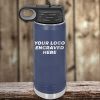 A blue water bottle with a black lid, featuring the laser-engraved text "Your Logo Engraved Here," sits on a wooden surface with a blurred background. Offered by Kodiak Coolers, this custom engraved drinkware requires no setup fee and caters to businesses seeking wholesale orders starting at $250.