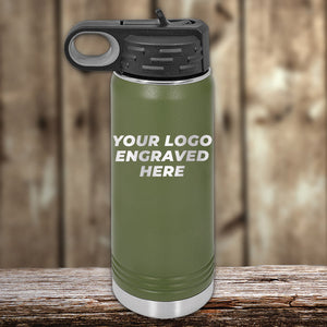 A green Kodiak Coolers insulated bottle with a black lid and carrying loop sits on a wooden surface, showcasing "YOUR LASER ENGRAVED LOGO HERE." Ideal for those looking for custom tumblers with no setup fee. $250 minimal order required during this special Presidents Day sale.