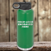 A green Kodiak Coolers 40 oz insulated water bottle with a black lid, engraved with "YOUR LOGO ENGRAVED HERE," is displayed on wood—perfect for custom branding during the Black Friday sale.