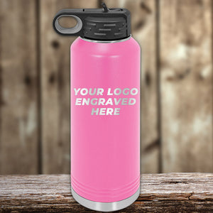 Pink Kodiak Coolers Custom Water Bottles 40 oz with your Logo or Design Engraved on a wooden surface.