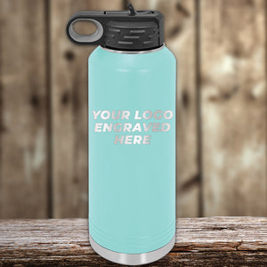 A blue Kodiak Coolers water bottle with the words "Custom Water Bottles 40 oz with your Logo or Design Engraved - Special Bulk Wholesale Volume Pricing" featuring custom logo laser engraving for a personalized touch.