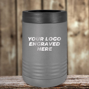 The Kodiak Coolers Engraved Custom Logo Drinkware, featuring single side engraving and bulk pricing, is pictured in gray on a wooden surface with a blurred wood background—perfect for business promotional gifts.
