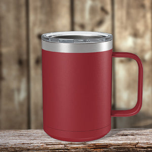 A red Custom Coffee Mug 15 oz with your Logo or Design Engraved by Kodiak Coolers resting on a wooden table.