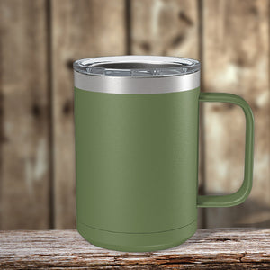An insulated Kodiak Coolers stainless steel coffee mug with a custom logo sits on a wooden table.