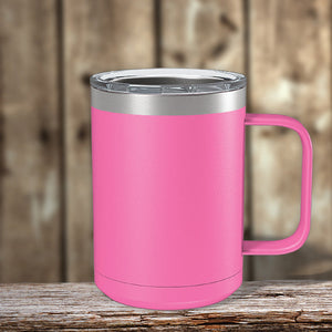 A pink Kodiak Coolers insulated Custom Coffee Mug 15 oz with your Logo or Design Engraved sits on a wooden table.
