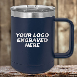 Kodiak Coolers Custom Coffee Mug, 15 oz, with your logo or design laser-engraved. Insulated with clear lid. Special Black Friday Sale volume pricing—LIMITED TIME. Navy blue mug shown on wooden surface, blurred background.