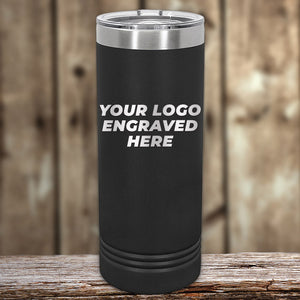 A black insulated Kodiak Coolers custom skinny tumbler with a customizable engraving area displayed on a wooden surface.