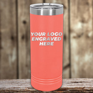 Coral-colored Kodiak Coolers Custom Skinny Tumblers 22 oz with your Logo or Design Engraved - Low 6 Piece Order Minimal Sample Volume displayed on a wooden surface.