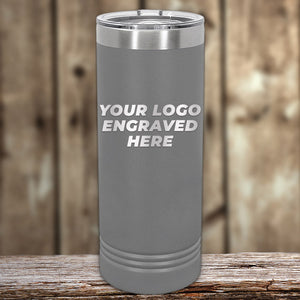 A gray Kodiak Coolers insulated tumbler with "Your Logo Engraved Here" sits elegantly on a wooden surface, ideal for those seeking custom drinkware. Enjoy no setup fee and a logo included in the price with a $250 minimum order during this special Presidents Day sale.