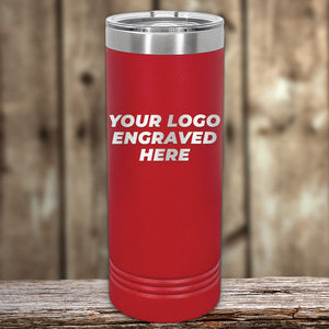 Red insulated Kodiak Coolers custom skinny tumbler with engraving space on a wooden surface.