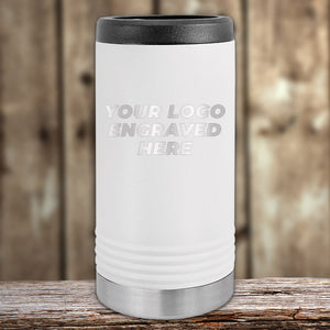 The white insulated tumbler with "Your Logo Engraved Here" stands on a wooden surface against a rustic background. This Kodiak Coolers product blends style and personalization, perfect for those seeking custom tumblers at wholesale prices. No setup fee; $250 minimum order for this Presidents Day sale.
