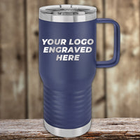 A blue insulated travel mug by Kodiak Coolers, featuring the text "Your Logo Engraved Here," sits on a wooden surface with a blurred wooden background. Perfect for custom tumblers with laser-engraved logos, available at wholesale prices from Custom Engraved Drinkware—no setup fee and $250 minimum order required.