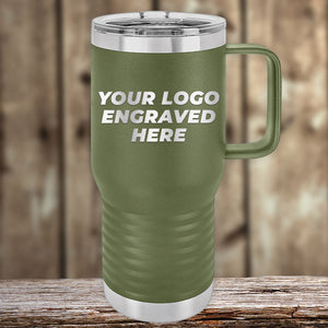 The green Kodiak Coolers insulated mug with a handle, engraved with "Your Logo Engraved Here," is elegantly set on a wooden surface against a blurred backdrop. This Custom Engraved Drinkware requires no setup fee and includes one side logo, with a $250 minimum order for the Presidents Day Sale.