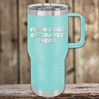 A turquoise Kodiak Coolers travel mug with handle, silver lid and base, and single-side engraved logo—ideal for business promos or custom gifts—sits on wood; bulk pricing available for this Engraved Custom Logo Drinkware.