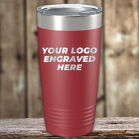 A red Kodiak Coolers Engraved Custom Logo Drinkware tumbler with a metal lid sits on wood, featuring "YOUR LOGO ENGRAVED HERE"—ideal for branded, personalized mugs. Single side engraving and bulk tiered pricing included.
