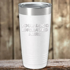 The Kodiak Coolers Set of 6 Custom Laser Engraved 20 oz Tumblers features a white matte stainless steel finish with "YOUR LOGO ENGRAVED HERE" on the front, displayed on wood. Low volume order, no setup fees, free shipping!.