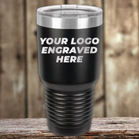 The Kodiak Coolers Engraved Custom Logo Drinkware features single-side engraving, showcased here with "YOUR LOGO ENGRAVED HERE" on a black travel tumbler—ideal for custom bulk orders to highlight your brand.