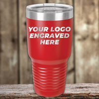 Red travel tumbler by Kodiak Coolers featuring your logo, laser engraved on wooden texture. Enjoy custom tumblers at wholesale prices with no setup fee; $250 minimal order required during the special Presidents Day Sale.
