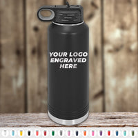Kodiak Coolers Custom Water Bottles, 40 oz, feature your logo or design laser-engraved on the front. Special Black Friday Sale—volume pricing for a limited time. Available in multiple colors, displayed with a lid on a wooden surface.