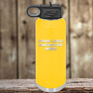 A yellow Kodiak Coolers insulated water bottle with a black lid and custom single-side logo engraving is displayed on wood—ideal for business promos or pairing with custom mugs. Bulk tiered pricing available.