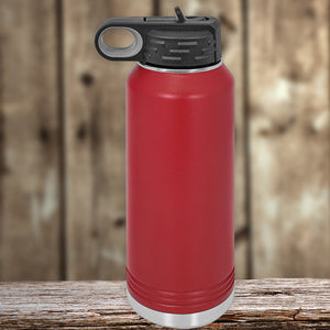 Kodiak Coolers 32 oz Custom Water Bottle with your Logo or Design Engraved - Special New Years Sale Bulk Pricing - LIMITED TIME, in red insulated stainless steel with a black lid, sitting on a wooden surface against a blurred wooden background.