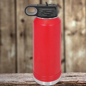 Custom Kodiak Coolers 32 oz insulated stainless steel water bottle with flip-top lid, resting on a wooden surface against a blurred wooden backdrop.
