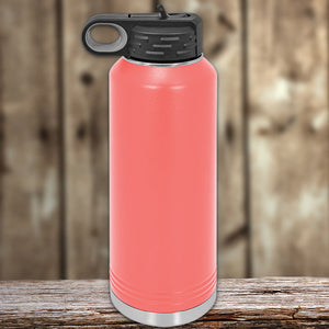 A red insulated stainless steel Custom Water Bottles 40 oz with your Logo or Design Engraved - Special New Years Sale Bulk Pricing - LIMITED TIME water bottle with a black lid on a wooden surface against a blurred background by Kodiak Coolers.