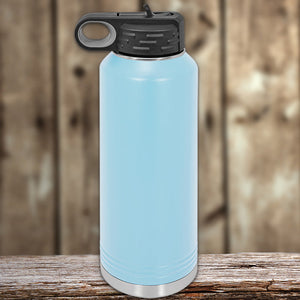 Blue Kodiak Coolers custom water bottles 40 oz with your logo or design engraved on a wooden surface against a wooden backdrop.