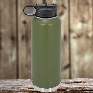Kodiak Coolers green insulated stainless steel water bottle on a wooden surface.