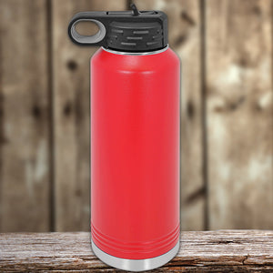 Kodiak Coolers Custom Water Bottles 40 oz with your Logo or Design Engraved - Special New Years Sale Bulk Pricing - LIMITED TIME on a wooden surface with a blurred background.