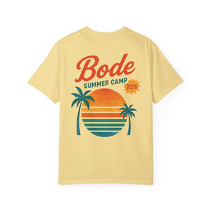 The Printify BODE Summer Camp T-Shirt 2026 — "Throwback Sunset" features a yellow Comfort Colors 1717 tee with an orange sunset, two palm trees, and "Bode Summer Camp 2026" graphic for a vibrant summer vibe. Unisex fit.