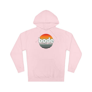 The 2026 Bode Summer Bootcamp — Cali Sunset Hoodie Sweatshirt (SS4500) by Printify is a light pink cotton-poly fleece hoodie with a front pocket, adjustable hood, and "bode SUMMER CAMP" logo featuring an orange-yellow sunset above green text.