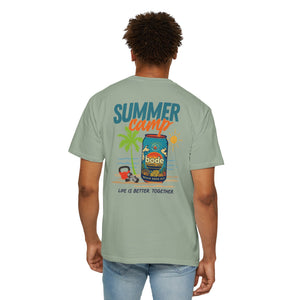 A man wearing a light green Printify BODE Summer Camp T-Shirt 2026, Unisex Comfort Colors 1717, with a "Life's Better Together" graphic and vintage beach scene on the back.