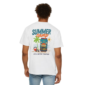 A man wears the Printify Summer Camp T-Shirt—‘Life Is Better Together’ Beach Can Design, featuring a heavyweight cotton build and summer camp-themed graphics with "SUMMER camp" and "Life is better together" on the back.