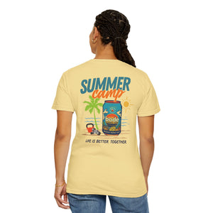 Someone in a yellow BODE Summer Camp T-Shirt 2026 by Printify, featuring a can, palm trees, sun graphic, and “Life’s Better Together” text on a Comfort Colors 1717 unisex tee.