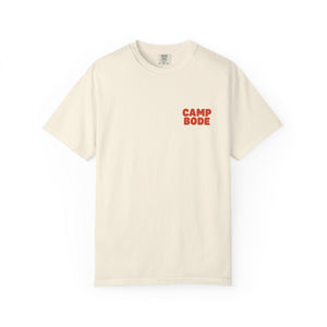 The BODE Summer Camp T-Shirt 2026—"Throwback Sunset" features bold red "CAMP BODE" print on off-white heavyweight cotton. A unisex Comfort Colors 1717 shirt by Printify, perfect for summer camp style.