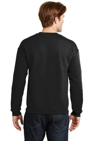 The individual is seen from behind wearing a Gildan Heavy Blend Crewneck Sweatshirt 18000 in black, paired with jeans, providing both comfort and style.