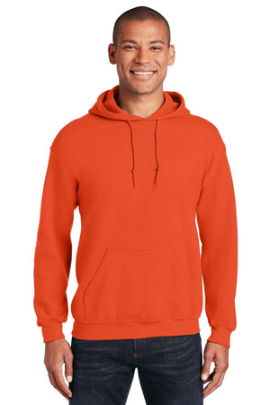 A man in a bright orange Gildan Heavy Blend Hoodie Sweatshirt 18500, featuring a front pocket and drawstrings, made from a soft cotton/poly blend, smiles against a white background.