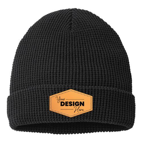 A black Richardson 146R Waffle Cuffed Beanie with an orange patch on the adjustable cuff.