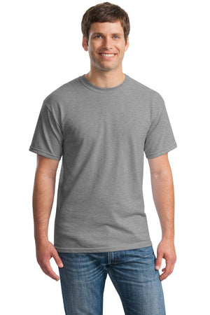A man faces forward and smiles against a white background, wearing a Gildan 5000 Heavy 100% Cotton Custom T-Shirt in grey and blue jeans.