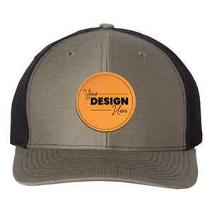 A Richardson 312 Twill Back Snapback Trucker Hat in gray and black with a logo on it.