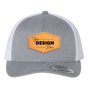 A YP Classics grey and white trucker hat with the words 'your design' on it. Made of polyester/cotton blend material with a snapback closure for a comfortable fit