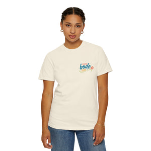 Someone faces forward wearing the cream-colored Summer Camp T-Shirt — 'Life Is Better Together' Beach Can Design by Printify, featuring a small chest logo, paired with blue jeans.
