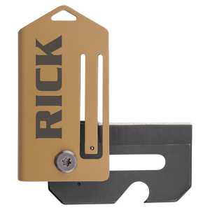 A compact Bison River 2" Everyday Carry Knife with a tan metal cover custom laser engraved "RICK" and a partially exposed black blade.
