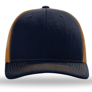 A navy and tan Richardson 112 Snapback Trucker Cap with a mesh back and pre-curved visor on a white background. SEO keywords: cotton/polyester.