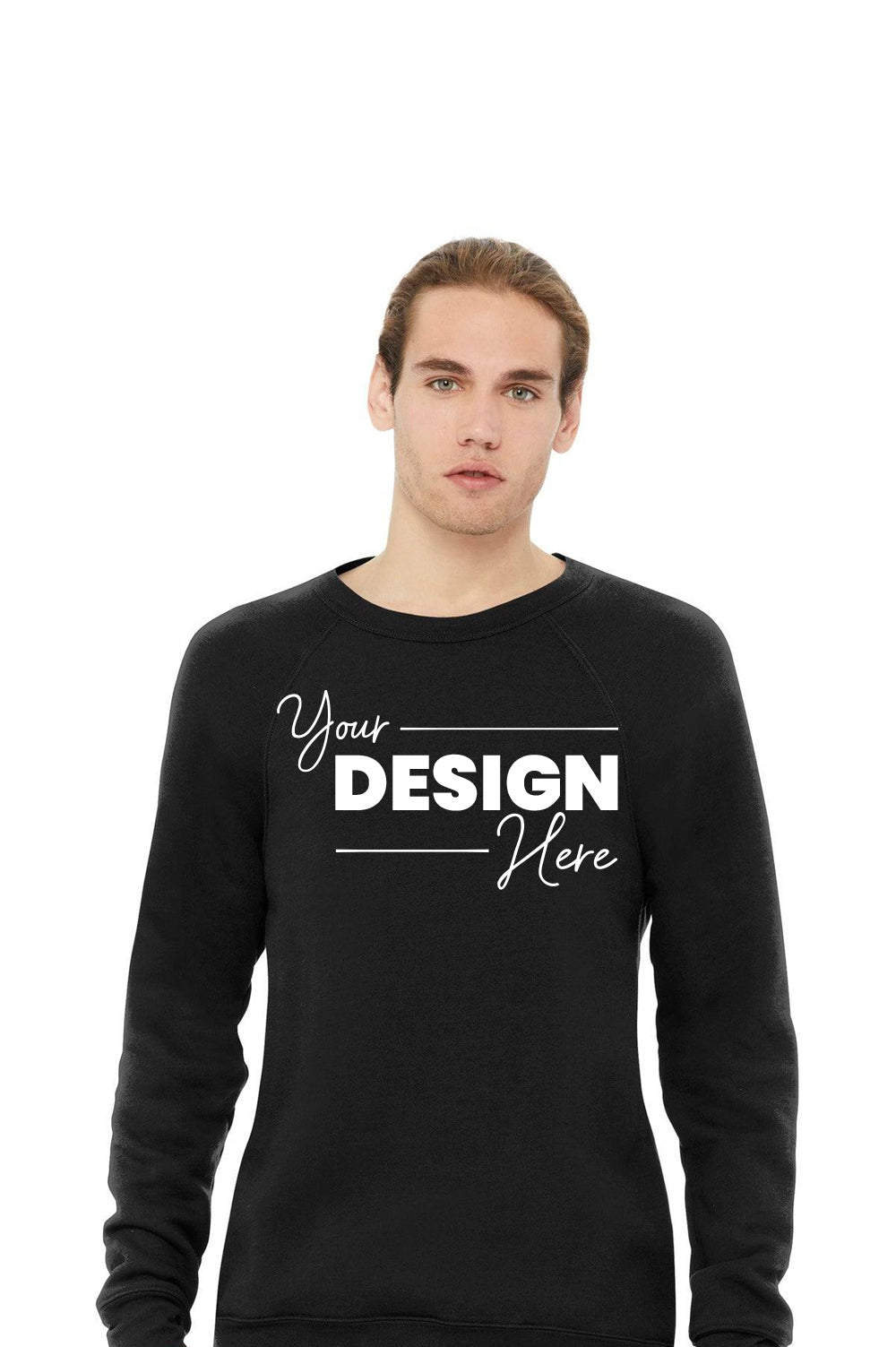 A person wearing a trendy Bella + Canvas BC3901 Sponge Fleece Raglan Crewneck Sweatshirt in black, showcasing "Your Design Here" on the front. Made with premium Airlume combed cotton for exceptional comfort and quality.