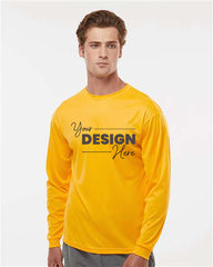 A man wearing a bright yellow C2 Sport Performance Long Sleeve T-Shirt by C2 Sport, featuring the text 