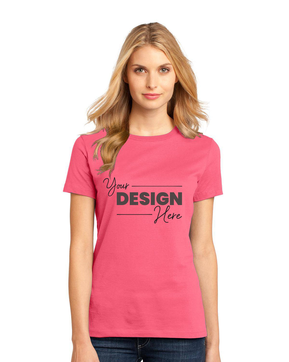 A person is wearing a pink District Women's Perfect Weight T-Shirt DM104L, crafted from 100% combed ring-spun cotton. Featuring "Your Design Here" on the front, this lightweight and durable tee offers comfort and style for any occasion.