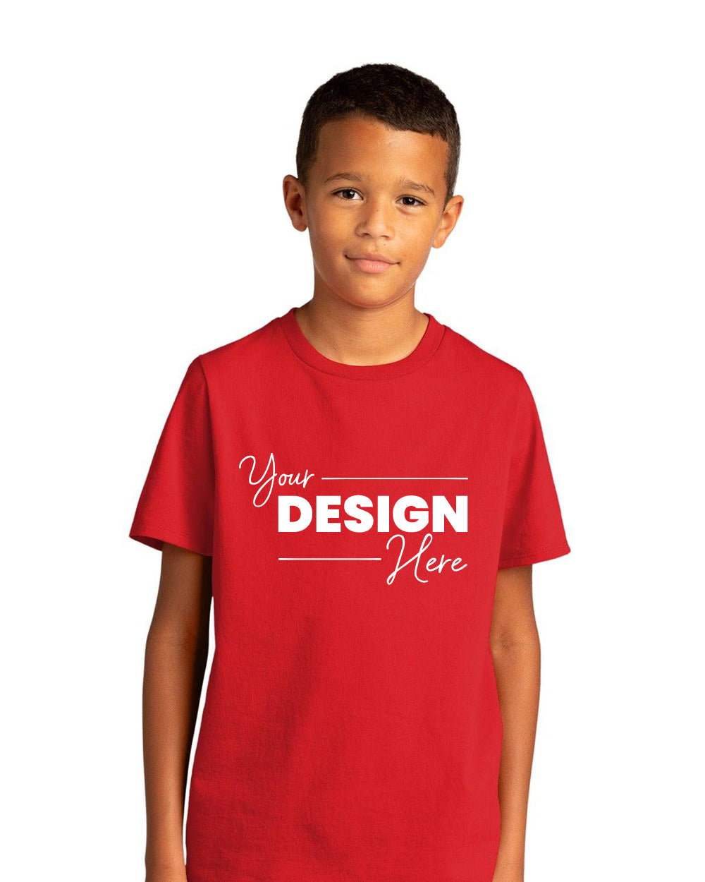 A boy stands against a white background wearing a red District Youth Re-Tee T-Shirt DT8000Y with "Your Design Here" text on the front, made from recycled fabric.